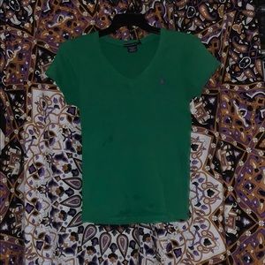 Green V-neck polo short sleeve shirt.